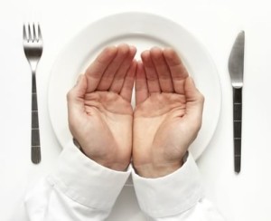 Empty hands over plate